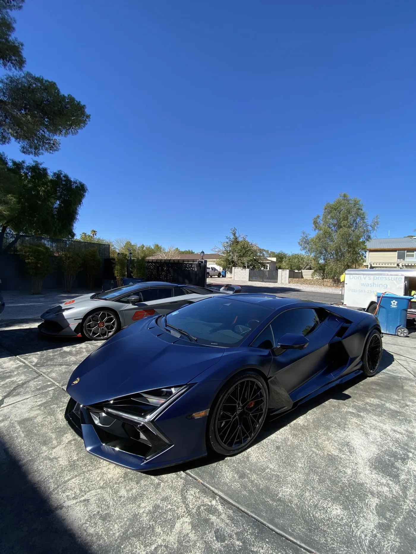 Dark blue Lamborghini parked in the sun after a detail