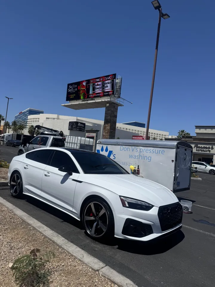White Audi sedan after detailing, with the Don V’s trailer behind it