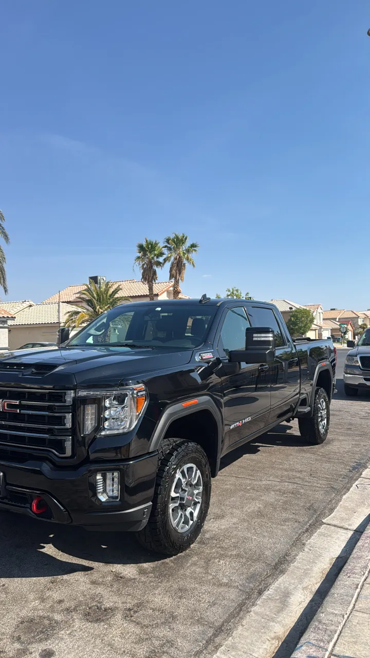 Black GMC Sierra pickup truck with clean paint and wheels